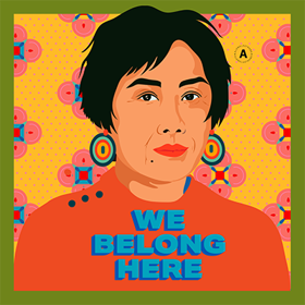 Graphic artwork features an Asian woman wearing an orange sweater against a floral background with the words "We Belong Here" written in blue letters.