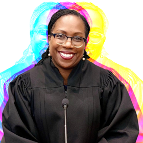 Judge Ketanji Brown Jackson sits in her judicial black robes, smiling at the camera 