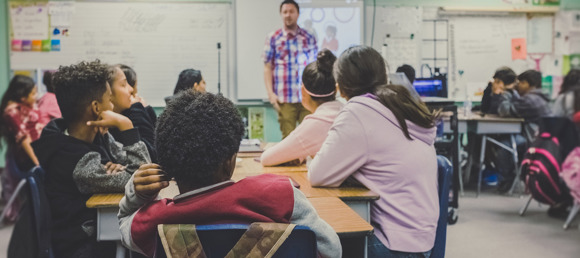 Student listens to class at their desk