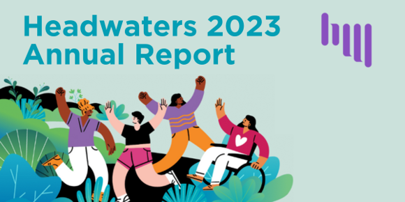 Pale green-blue header image with text "Headwaters 2023 Annual Report". Below the text is an illustration of four people in colorful clothes waving their arms at each other from a plant-filled backdrop. A purple version of the Headwaters logo is in the top right corner.