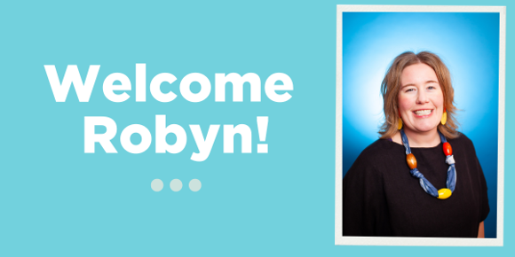 An aquamarine blue header image with a smiling headshot of Robyn. Large white text next to her says "Welcome Robyn!" with three pale blue dots underneath. 