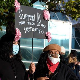 Two immigrant women at a protest