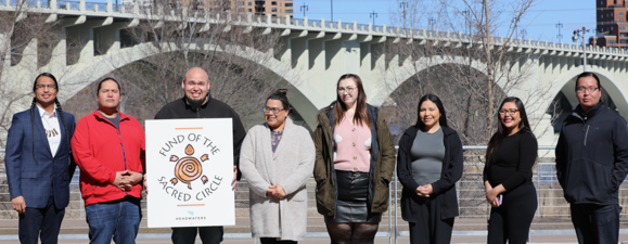 Native Community Grantmaking Circle members standing outside smiling at the camera