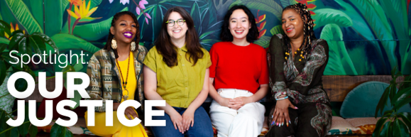 Our Justice staff smiling in front of a vibrant leafy mural