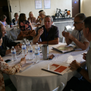 Isabella Project committee members brainstorm at a table
